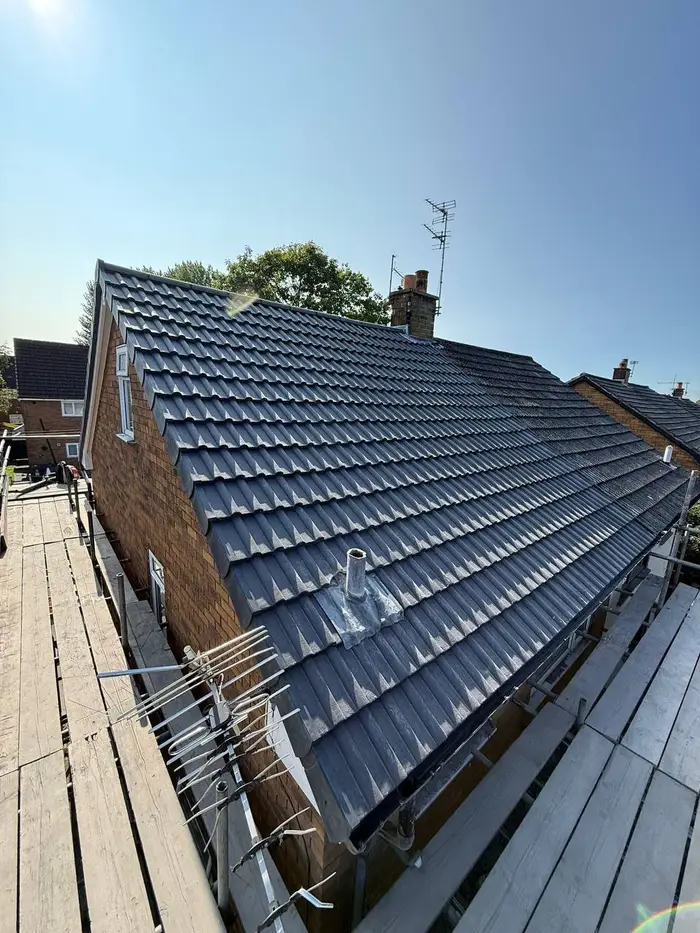 Re-roof with dark grey tiles