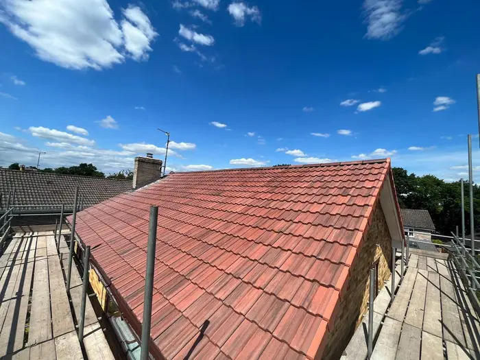 Fresh red clay tiled roof in sunshine